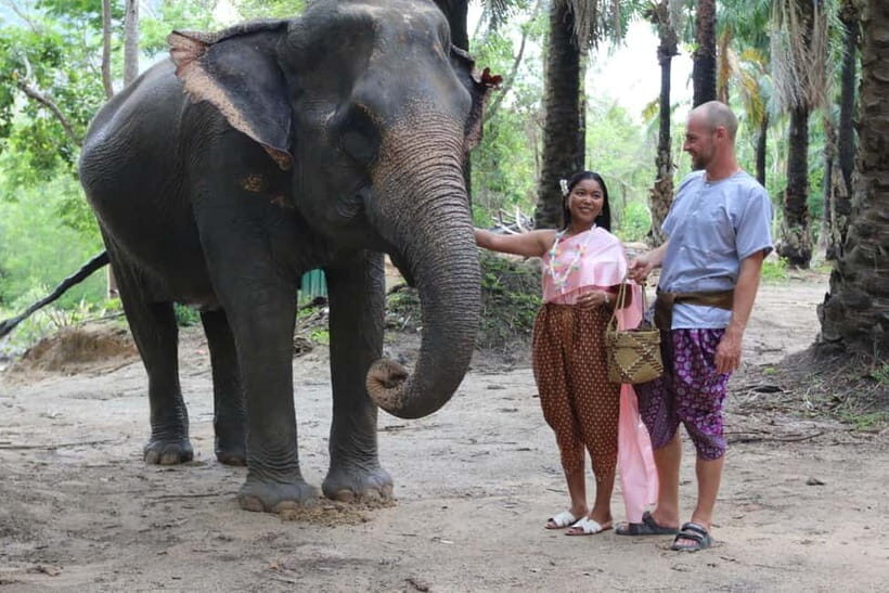 Krabi: Elephant Feeding Program with Traditional Thai Dress - Safety, insurance, and the passport photo detail