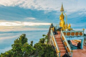Tiger Cave Temple - Discover the real Jungle - Wat Tham Suea at Tiger Cave Temple: jungle approach to caves and cliffs
